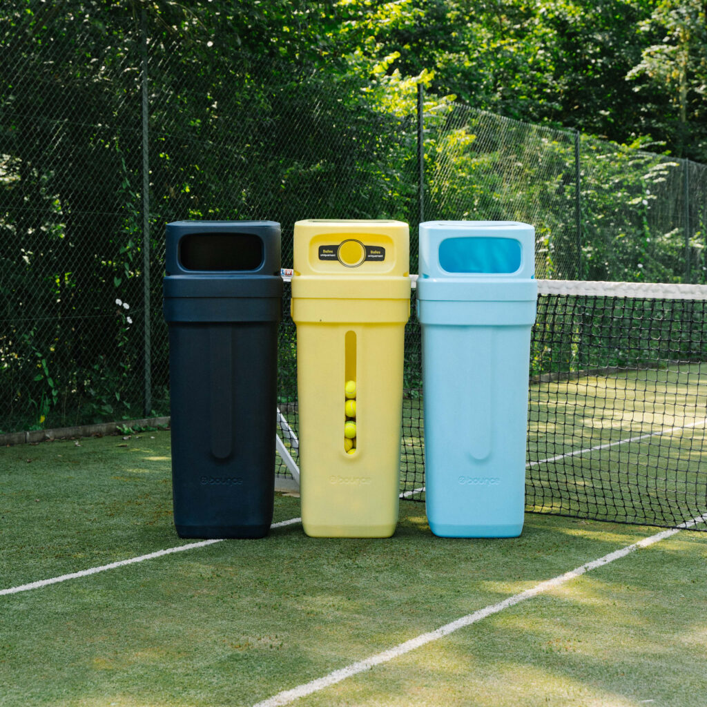 a group of trash cans on a tennis court